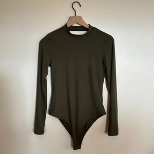 NWOT. Originality Long Sleeve Bodysuit. Olive Green. Medium.